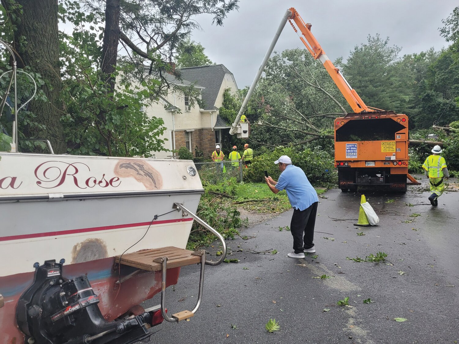 BOAT LOAD OF DAMAGE: This boat was tossed into the trees, and a few trees fell onto Amber Street houses. Residents were unable to exit via George Waterman for hours following the storm.